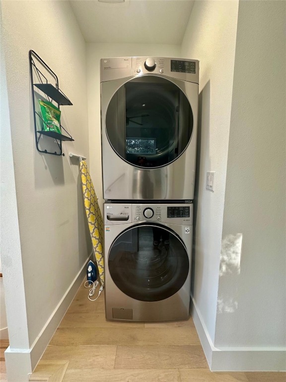3417 Elija Street, Unit 2 Austin, TX 78745 - Photo 10 of 28 Laundry room featuring estacked washer and dryer and light wood-type flooring