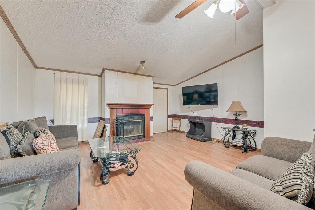130 Meadowview Lane Point, TX 75472 - Photo 8 of 9 a living room with furniture and a fireplace