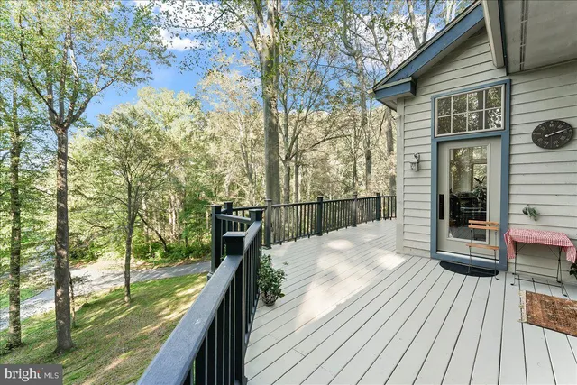 a living room with fireplace furniture and a chandelier