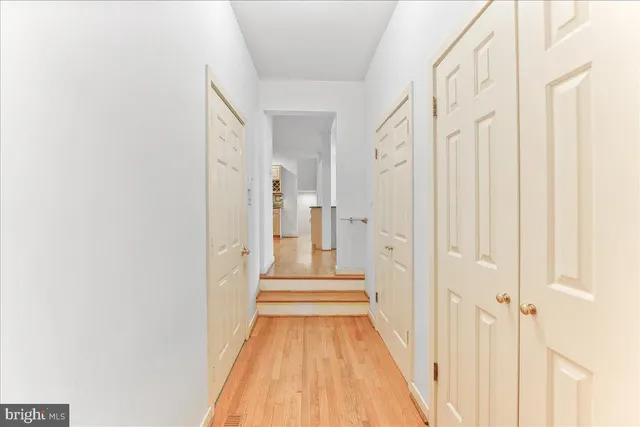 a bathroom with a sink double vanity granite tub shower and glass door