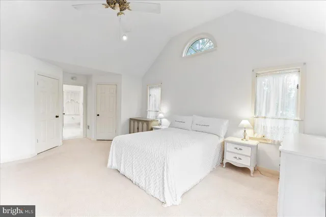 a bathroom with a sink and mirror with toilet