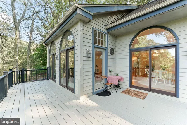 a spacious bedroom with a bed and a window