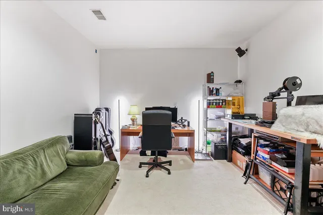a view of a balcony with table and chairs