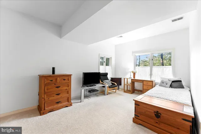a bedroom with a bed and a cabinets