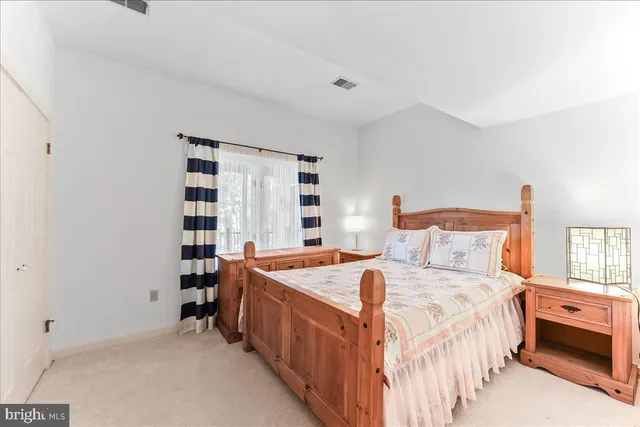 a view of a house with wooden fence