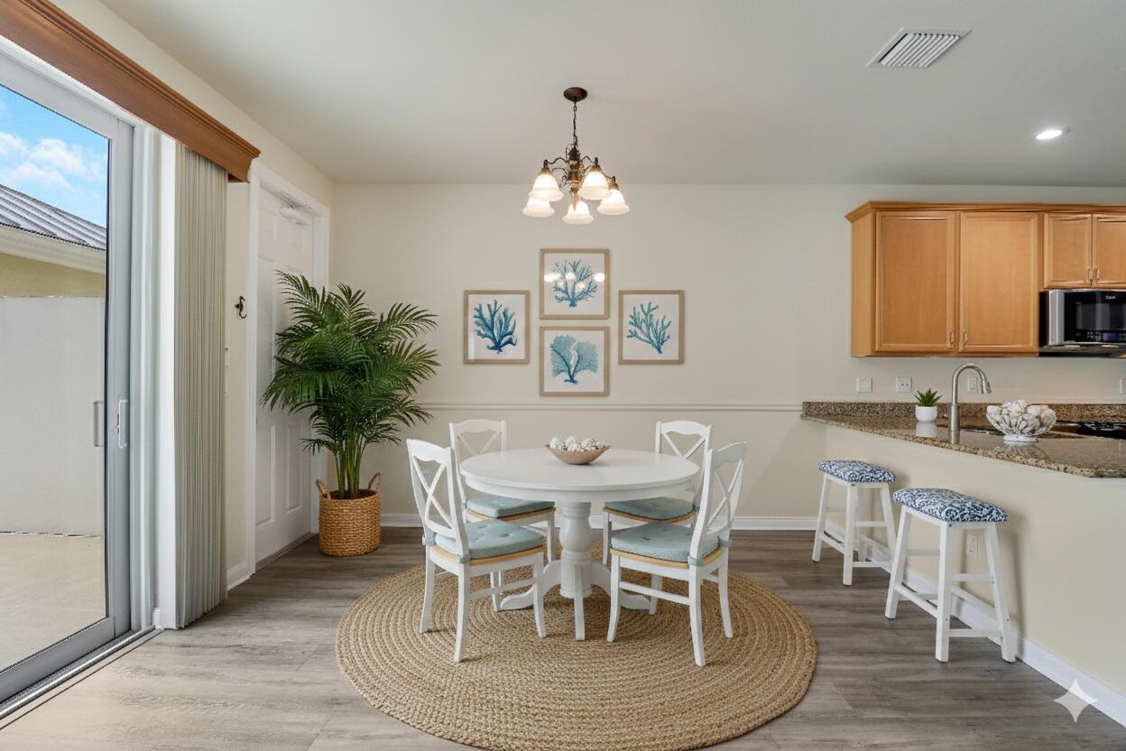 1043 Key Largo Street Jupiter, FL 33458 - Photo 11 of 46 a view of a dining room with furniture window and wooden floor