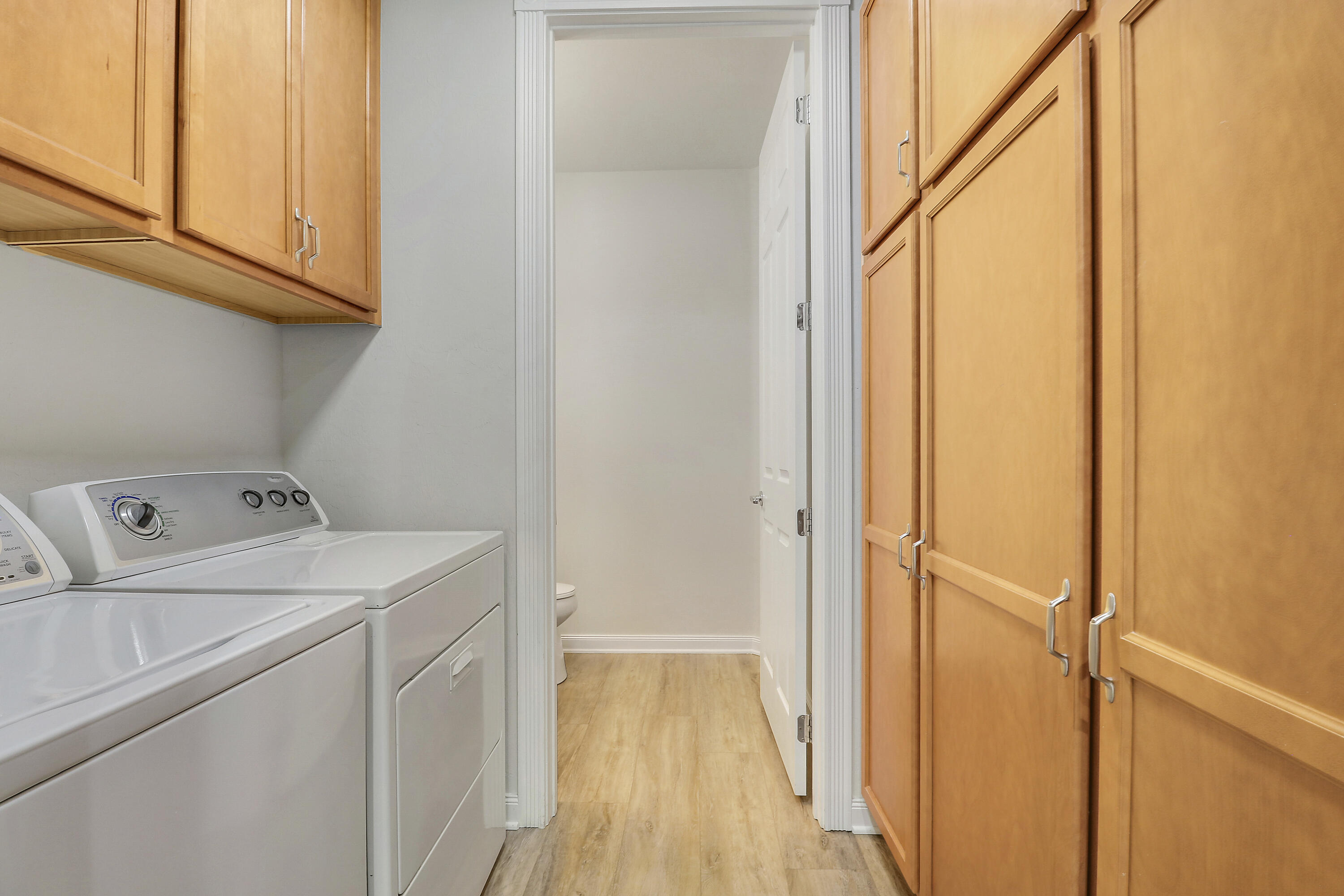 1043 Key Largo Street Jupiter, FL 33458 - Photo 17 of 46 a utility room with dryer and washer