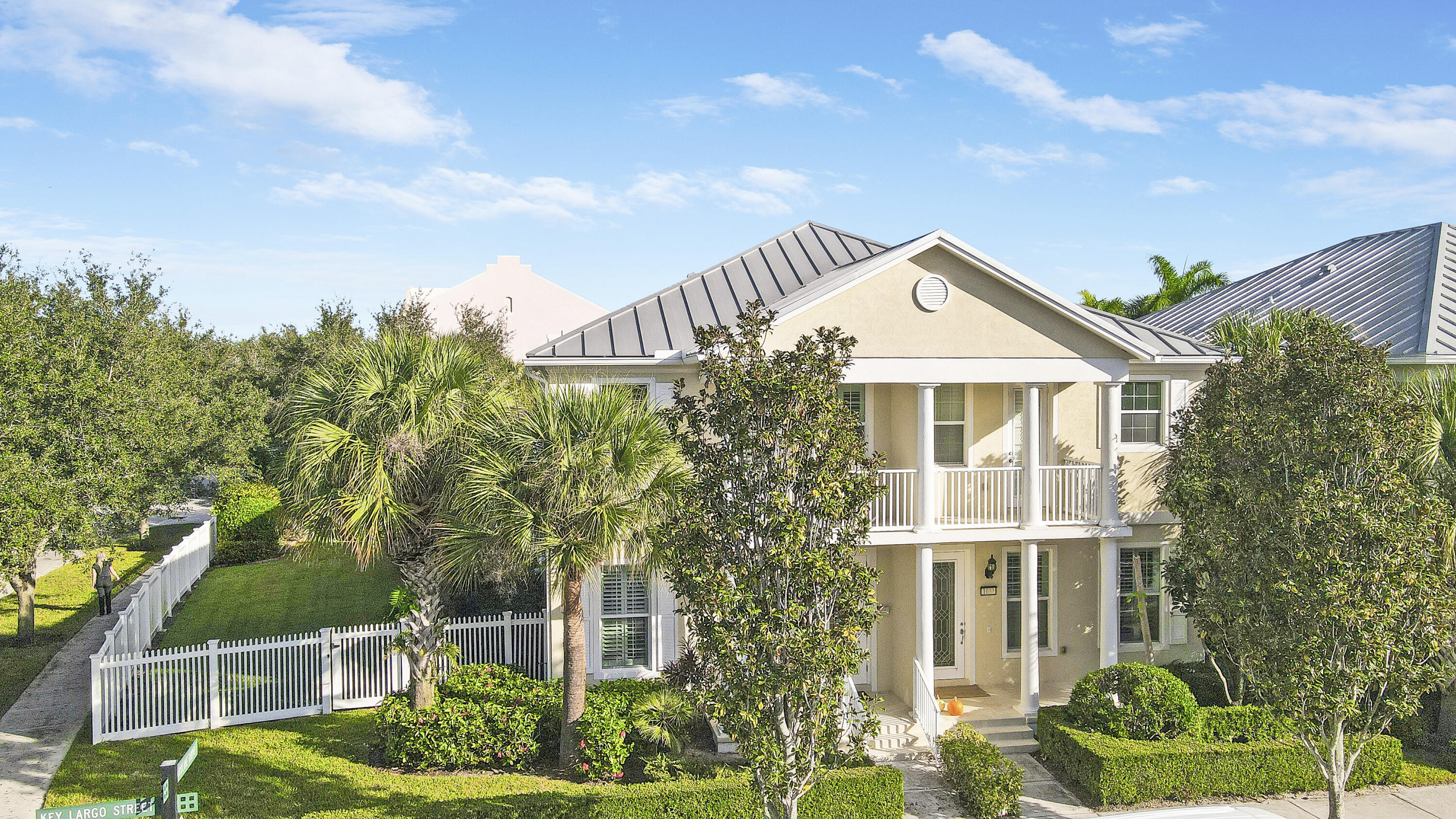 1043 Key Largo Street Jupiter, FL 33458 - Photo 2 of 46 a front view of a house with garden