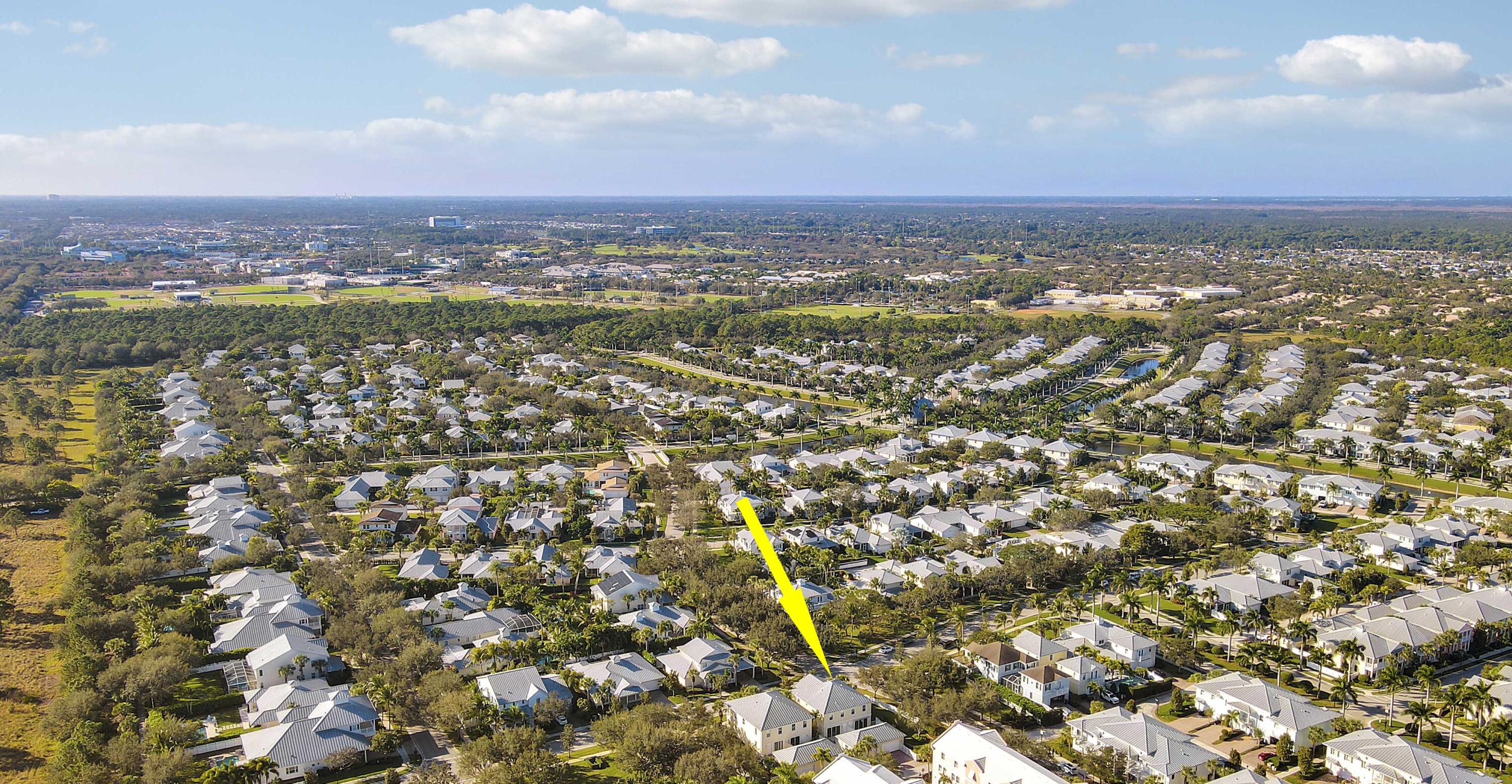 1043 Key Largo Street Jupiter, FL 33458 - Photo 43 of 46 an aerial view of residential building with parking space