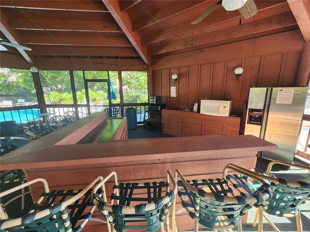 a view of a hallway with furniture