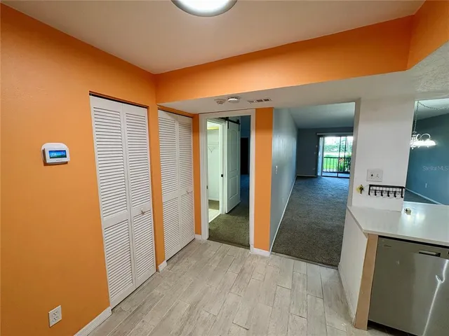 a view of a kitchen cabinets and wooden floor
