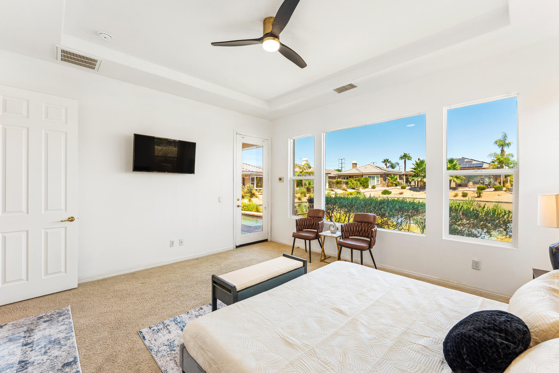 65 Shoreline Drive Rancho Mirage, CA 92270 - Photo 13 of 29 a bedroom with furniture and a flat screen tv