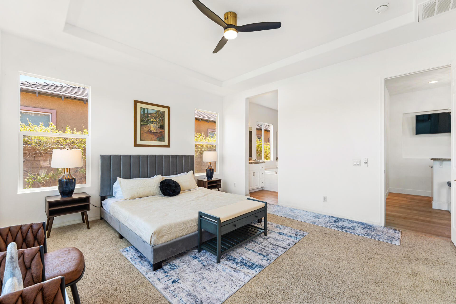 65 Shoreline Drive Rancho Mirage, CA 92270 - Photo 17 of 29 a bedroom with a bed a couch and a window