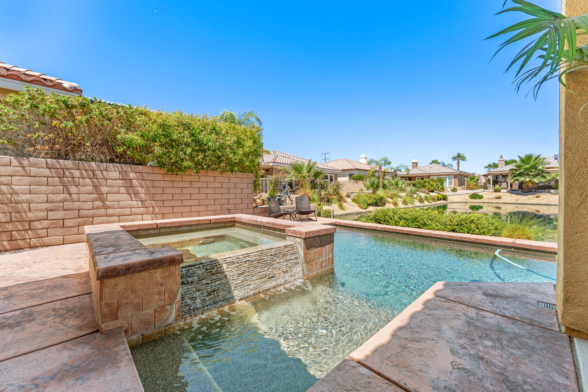 65 Shoreline Drive Rancho Mirage, CA 92270 - Photo 25 of 29 a view of swimming pool with outdoor seating and plants