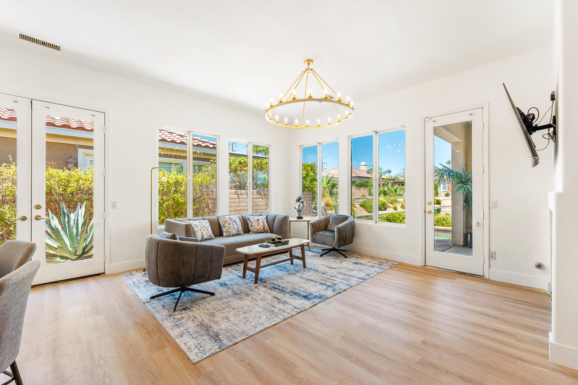 65 Shoreline Drive Rancho Mirage, CA 92270 - Photo 7 of 29 a living room with furniture and a wooden floor