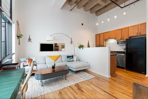 a living room with furniture and a table