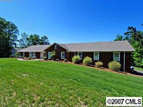 9921 Withers Road Charlotte, NC 28278 - Photo 1 of 8 a view of an house with backyard space and garden
