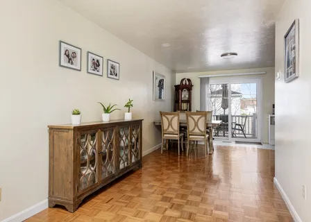 a view of a dining room with furniture window and outside view