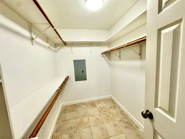 a view of a big room with wooden floor and staircase