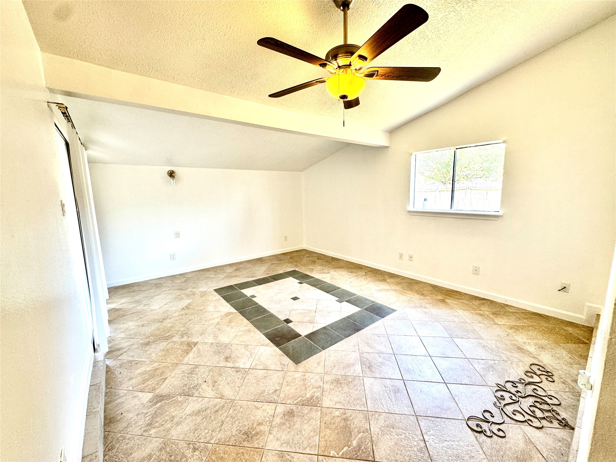 7203 Addicks Clodine Road Houston, TX 77083 - Photo 18 of 21 a view of a big room with carpet and a chandelier fan