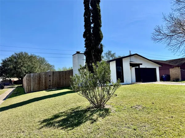 a house view with a garden space