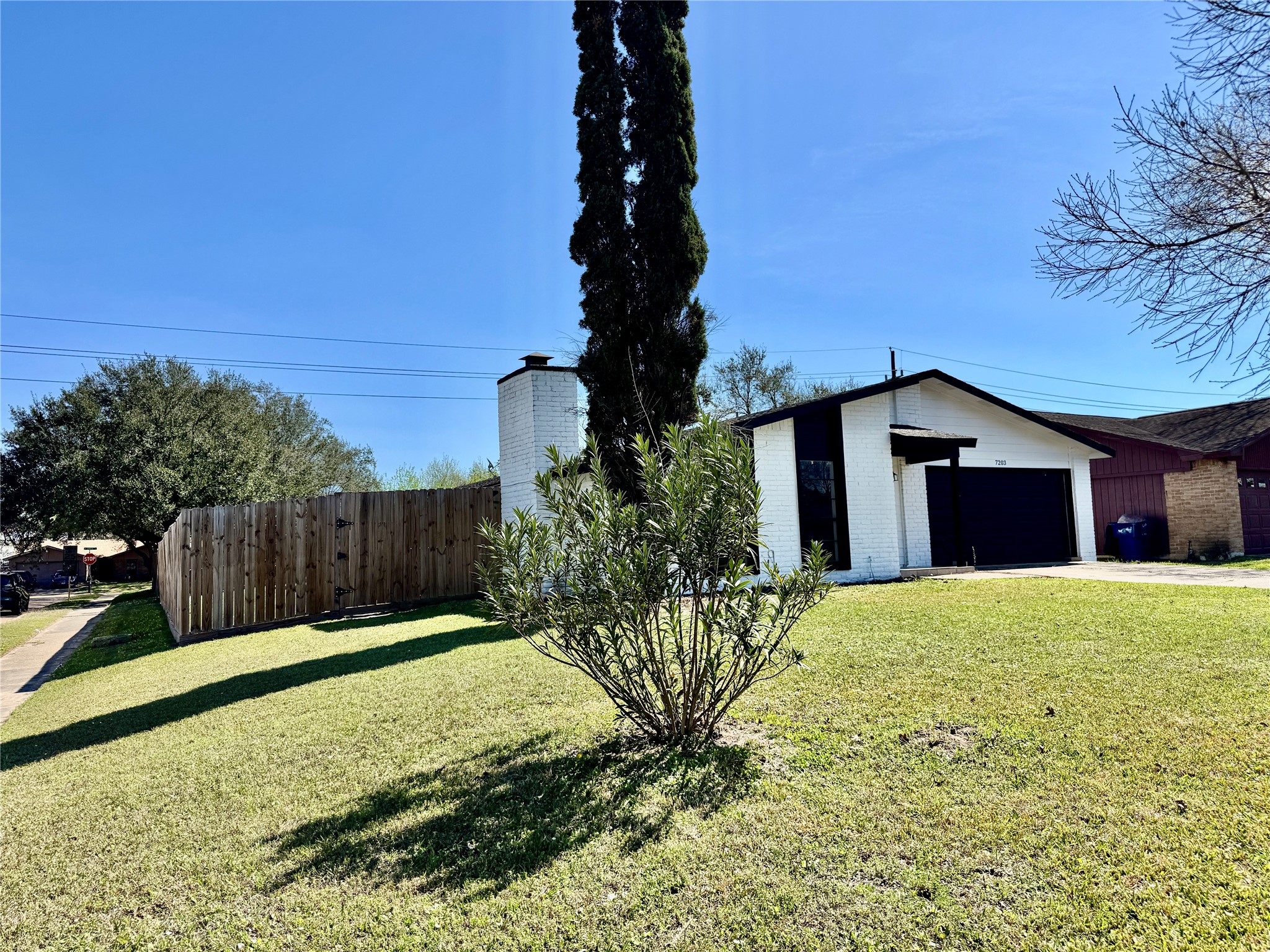 7203 Addicks Clodine Road Houston, TX 77083 - Photo 4 of 21 a house view with a garden space