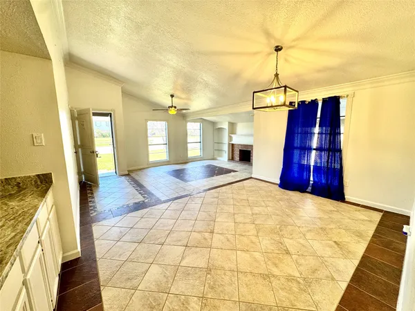 a view of a kitchen with a sink and wooden floor