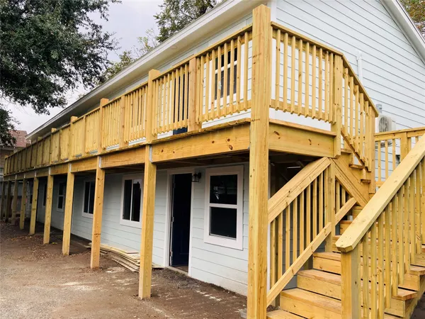 a view of a house with large windows