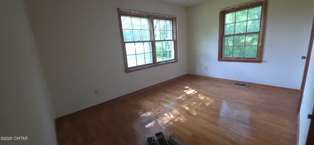 an empty room with windows