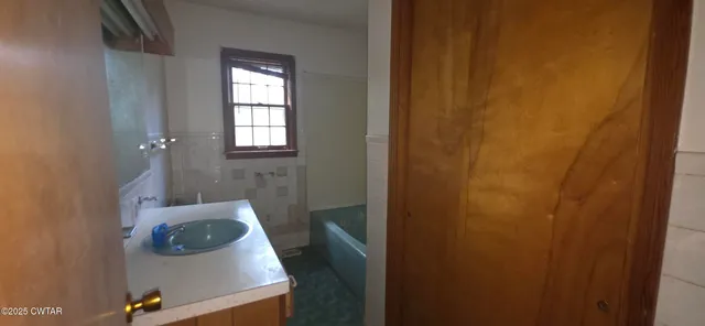 a bathroom with a sink and tub