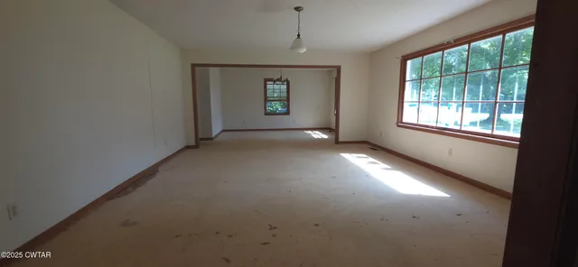 an empty room with windows