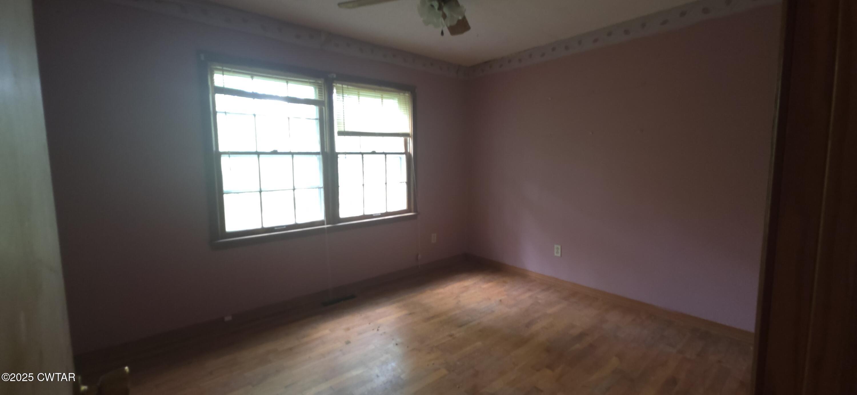 224 Bible Grove Road Lexington, TN 38351 - Photo 10 of 13 an empty room with a window