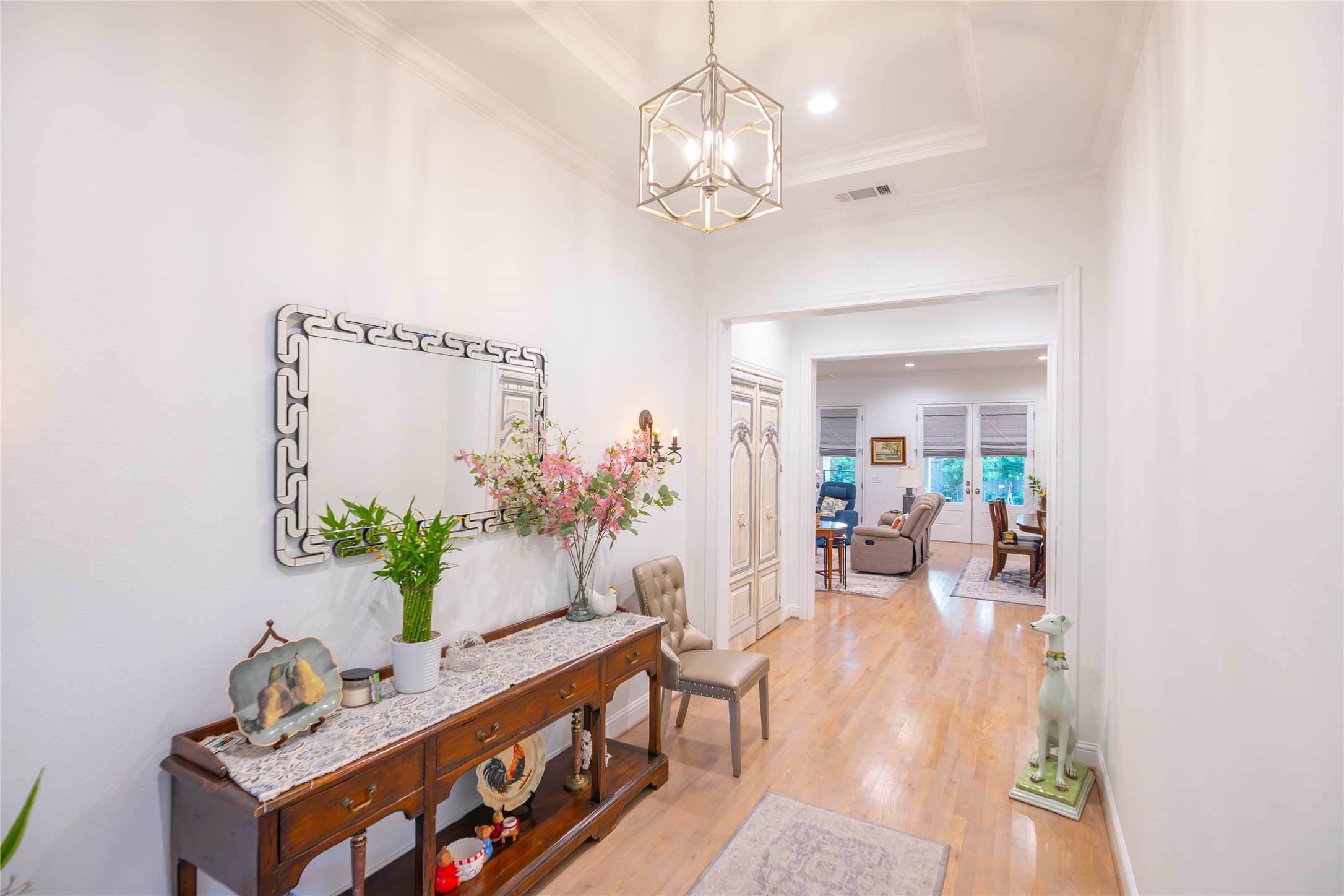 10614 Moonlight Drive Houston, TX 77096 - Photo 6 of 27 a living room with furniture and a chandelier