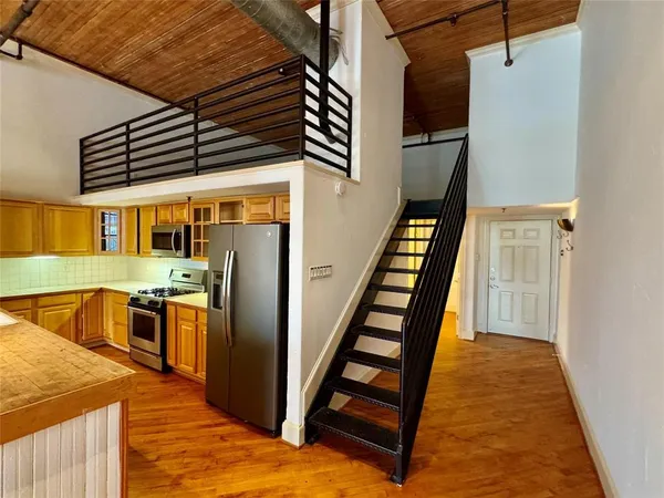 a view of a kitchen with a sink and dishwasher
