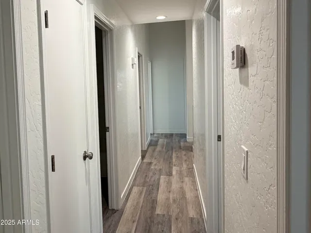 a view of a bathroom from a hallway