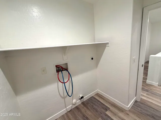 a room with shoes and wooden floor