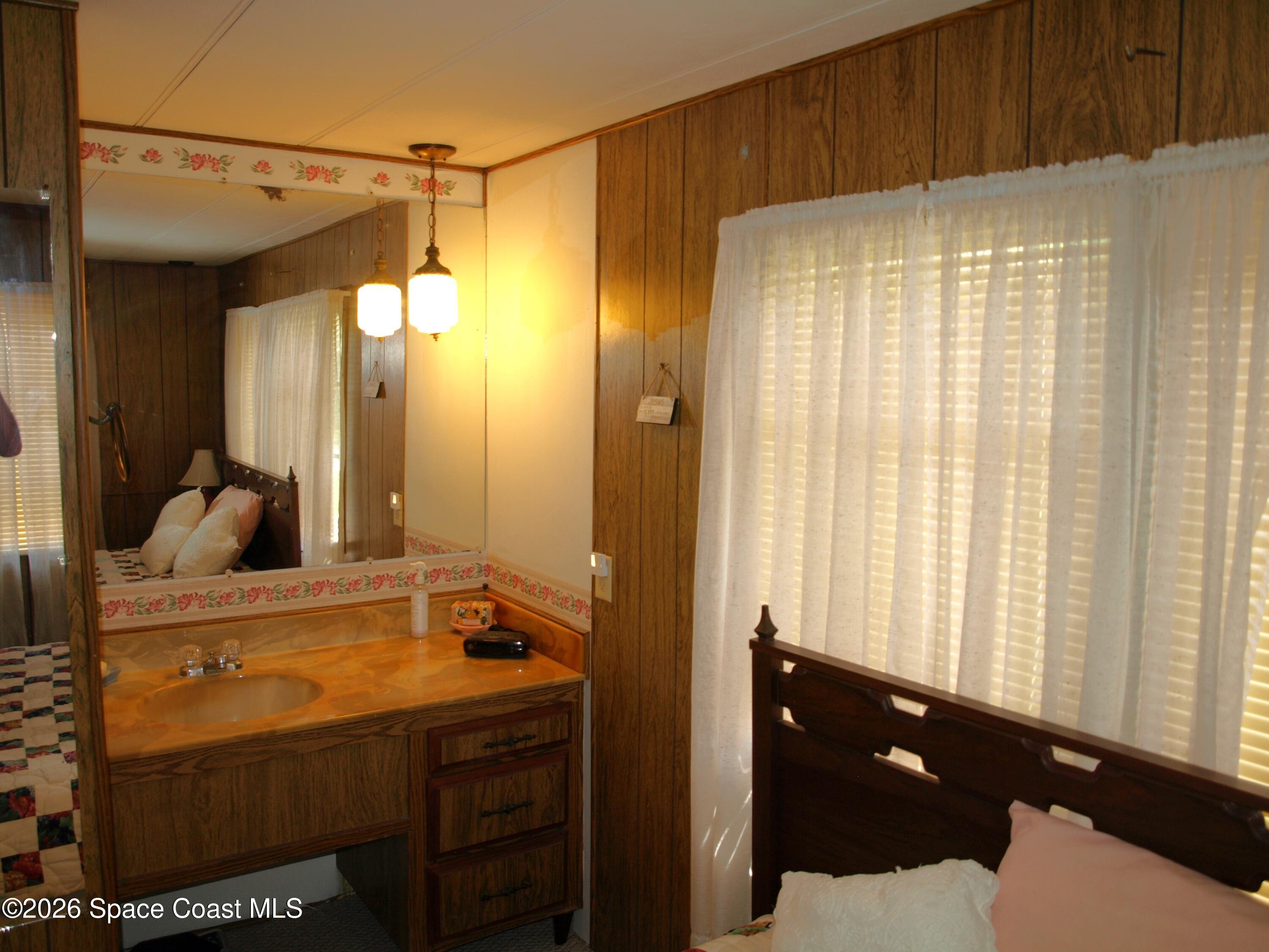 130 Palm Drive Georgetown, FL 32139 - Photo 13 of 23 a bathroom with a sink vanity and a mirror
