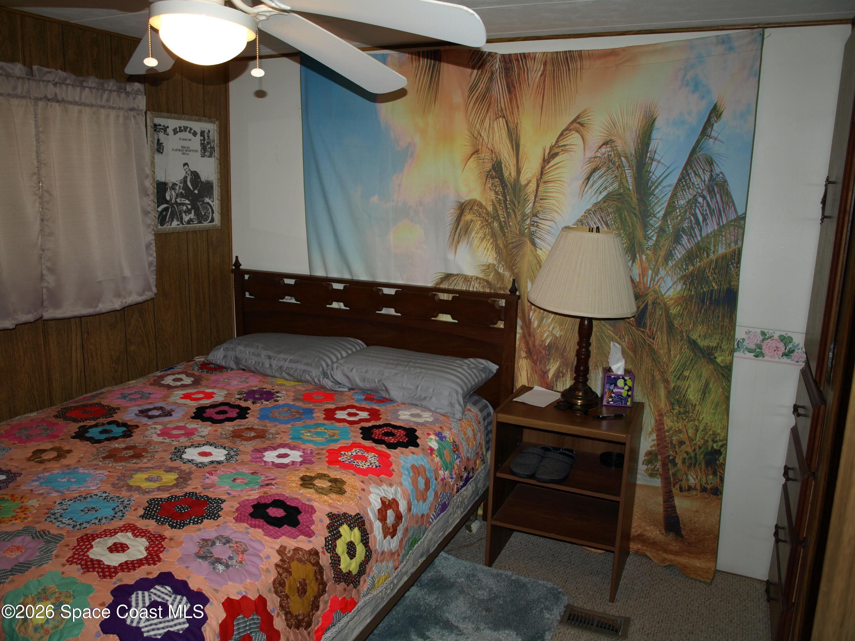 130 Palm Drive Georgetown, FL 32139 - Photo 16 of 23 a bedroom with a bed and a lamp on the dresser