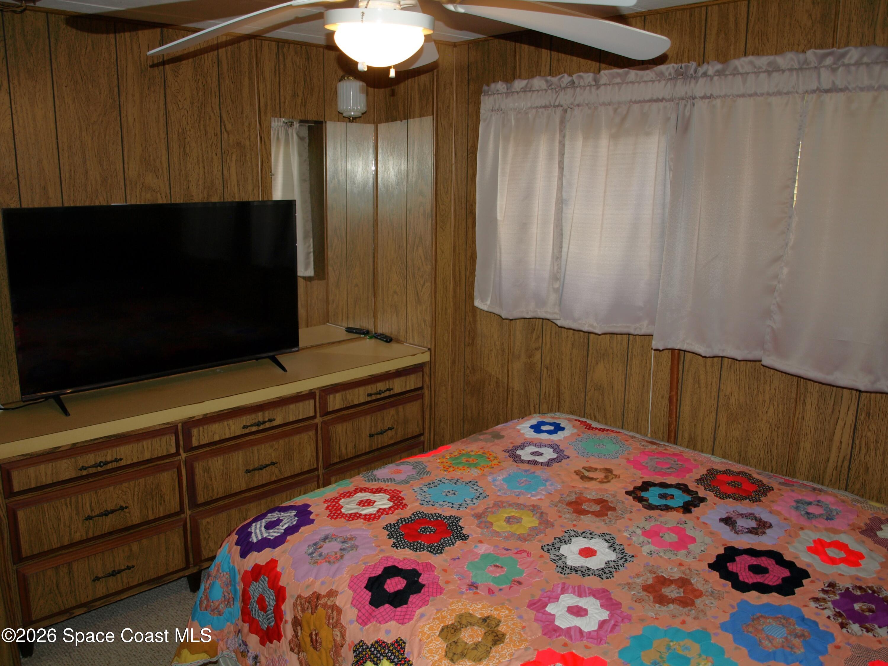 130 Palm Drive Georgetown, FL 32139 - Photo 17 of 23 a bedroom with a bed and a television