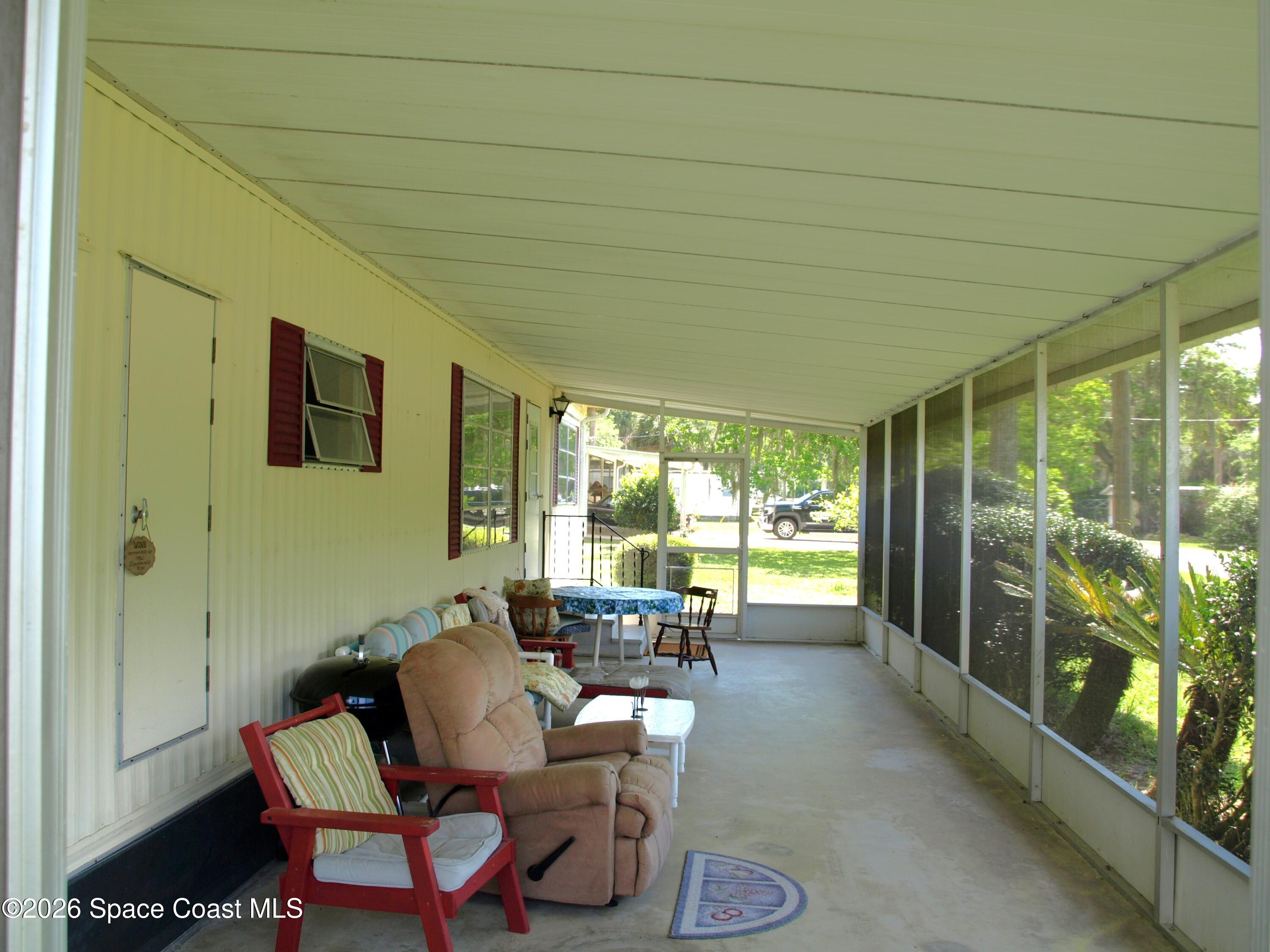 130 Palm Drive Georgetown, FL 32139 - Photo 20 of 23 a living room with furniture and a large window