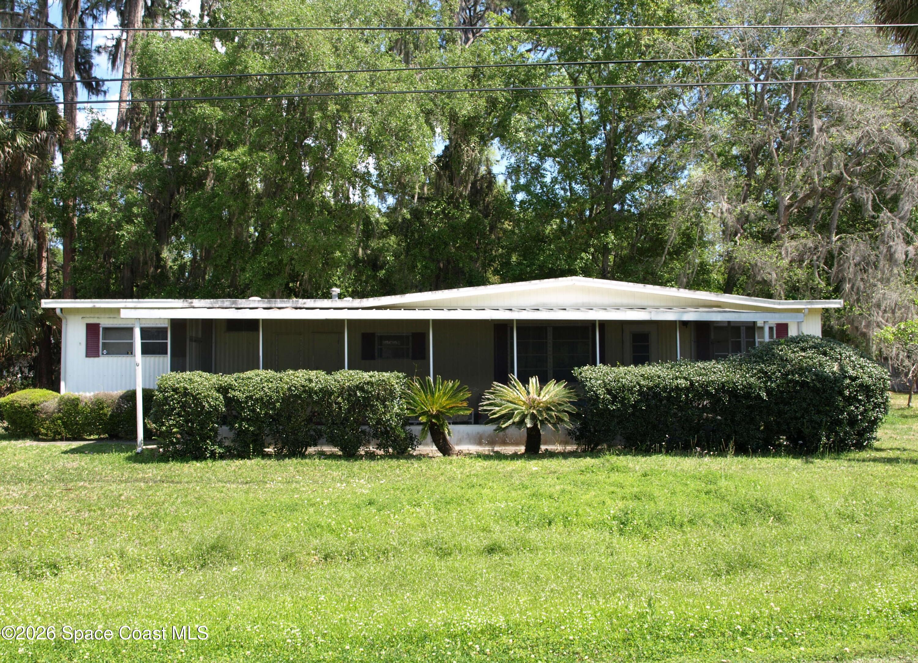 130 Palm Drive Georgetown, FL 32139 - Photo 5 of 23 a front view of a house with garden
