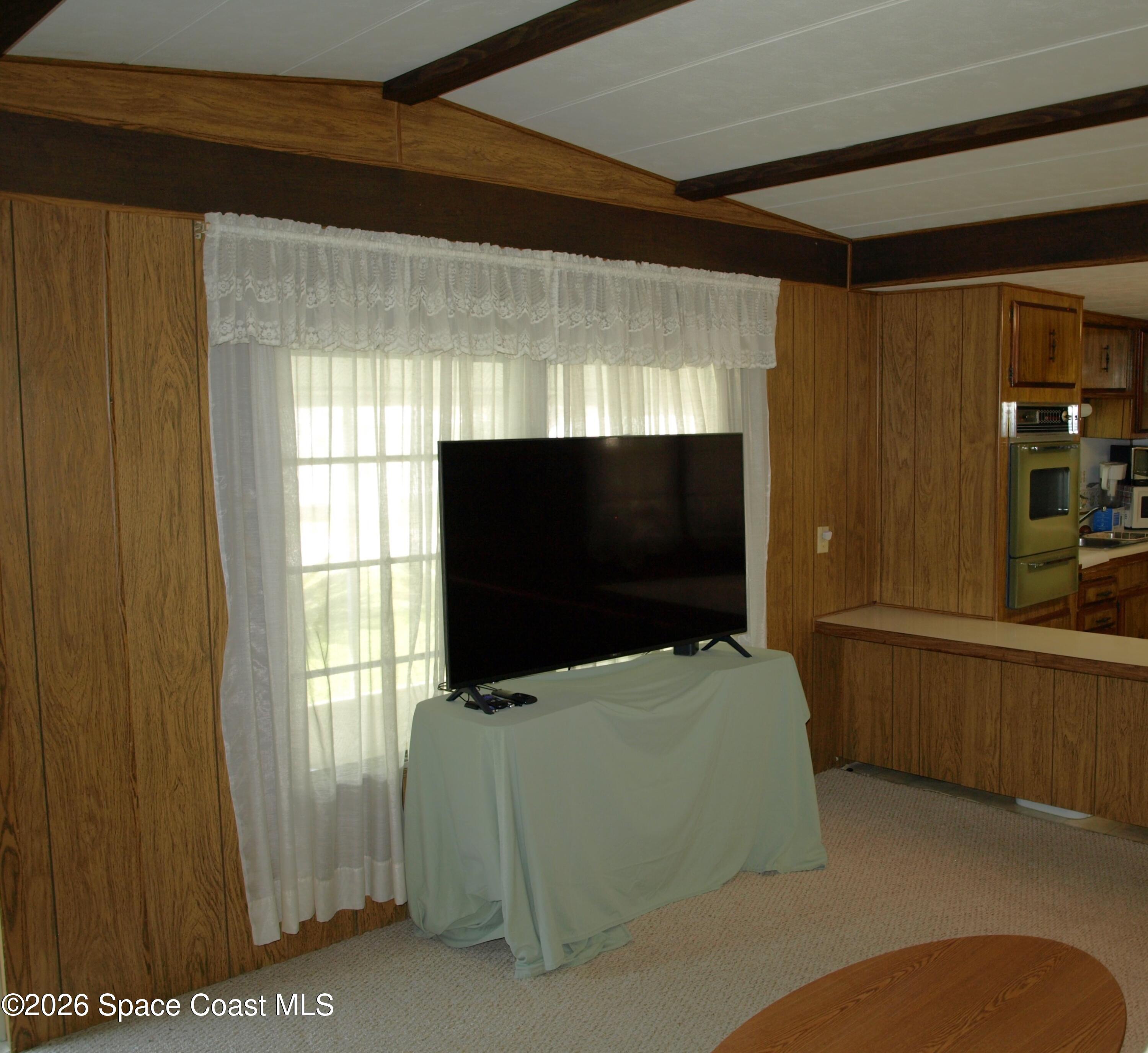 130 Palm Drive Georgetown, FL 32139 - Photo 8 of 23 a living room with furniture and a flat screen tv