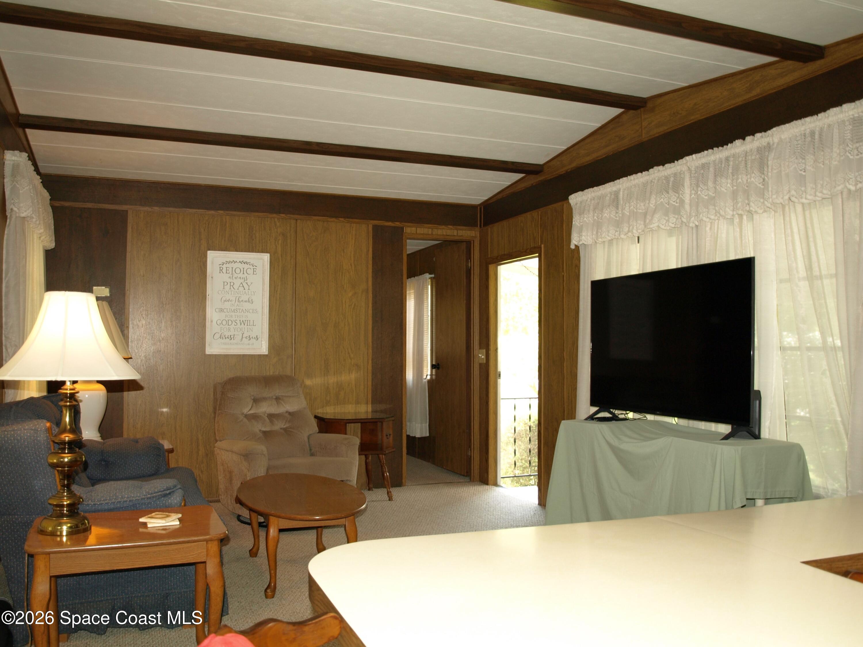 130 Palm Drive Georgetown, FL 32139 - Photo 9 of 23 a living room with furniture and a flat screen tv