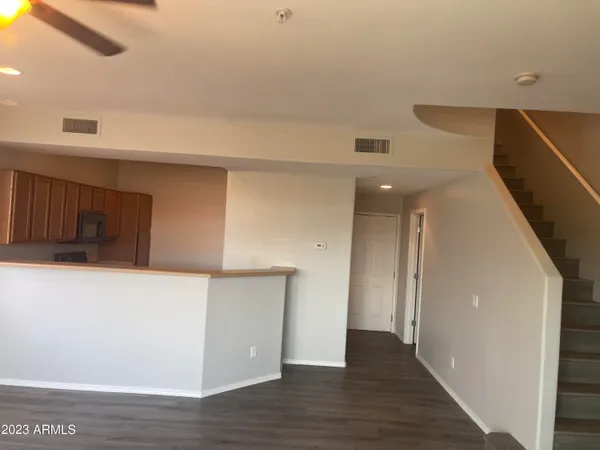a view of hallway with wooden floor