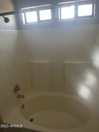 a close up of a bathtub in a bathroom