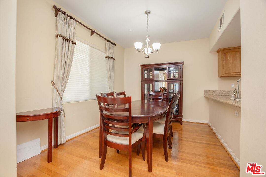 1128 West Duarte Road, Unit A Arcadia, CA 91007 - Photo 11 of 28 a view of a dining room with furniture and wooden floor