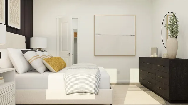 a bedroom with a bed and a dresser