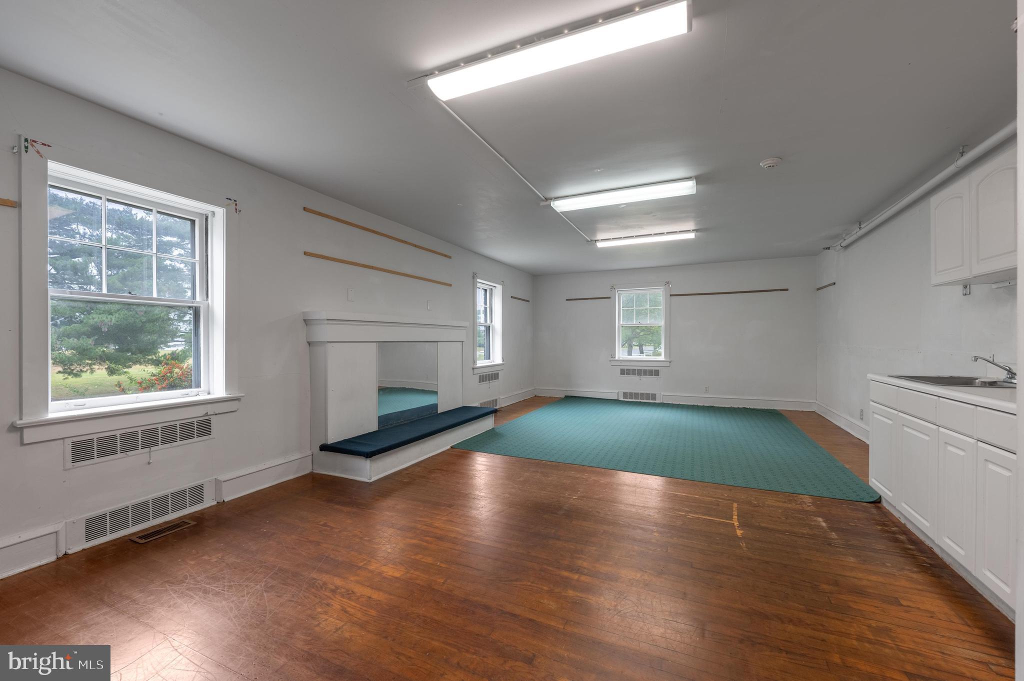 189 Watsontown Road Berlin, NJ 08009 - Photo 13 of 35 a view of empty room with window and wooden floor