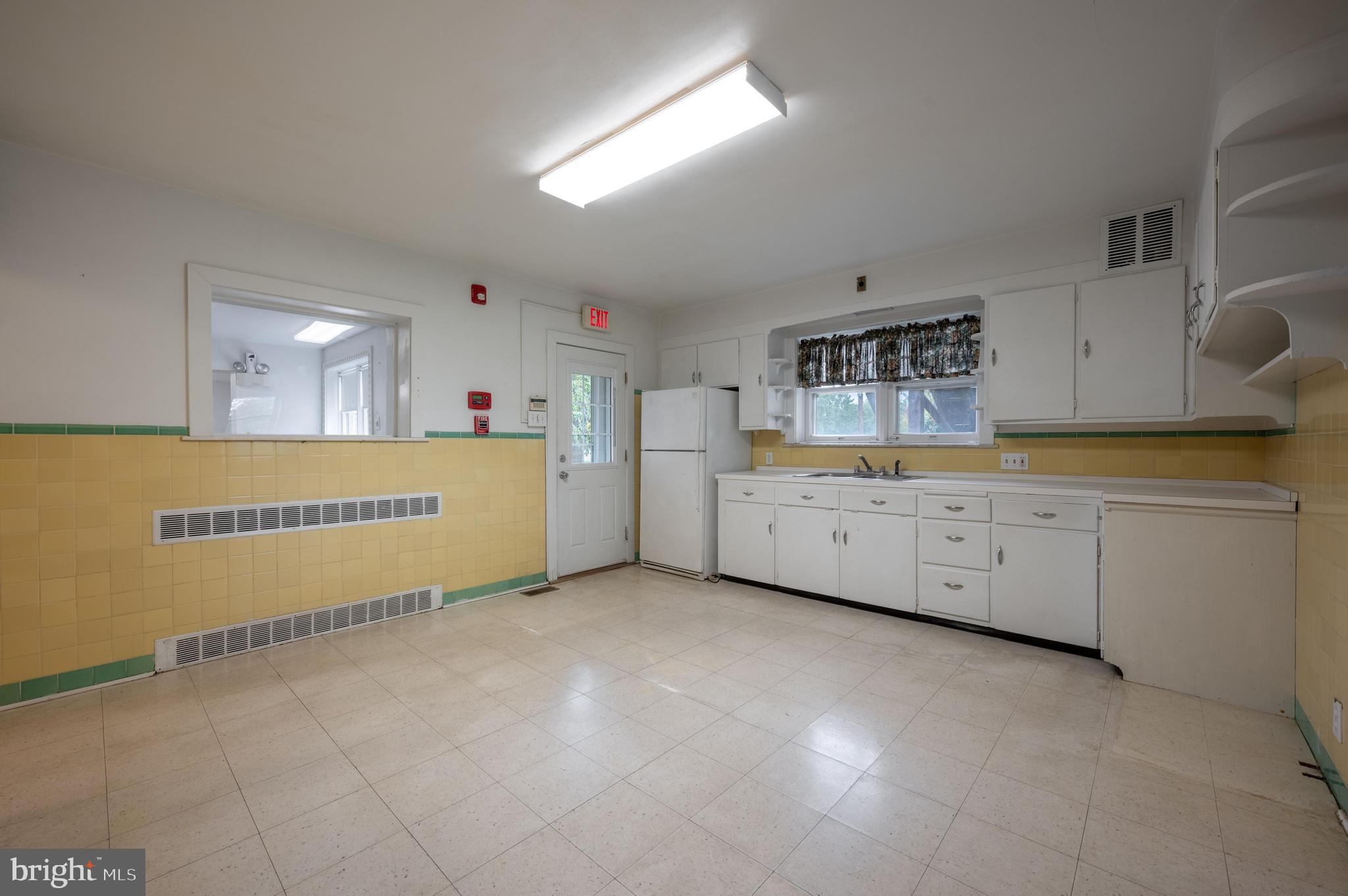 189 Watsontown Road Berlin, NJ 08009 - Photo 16 of 35 a view of a kitchen with cabinets and wooden floor