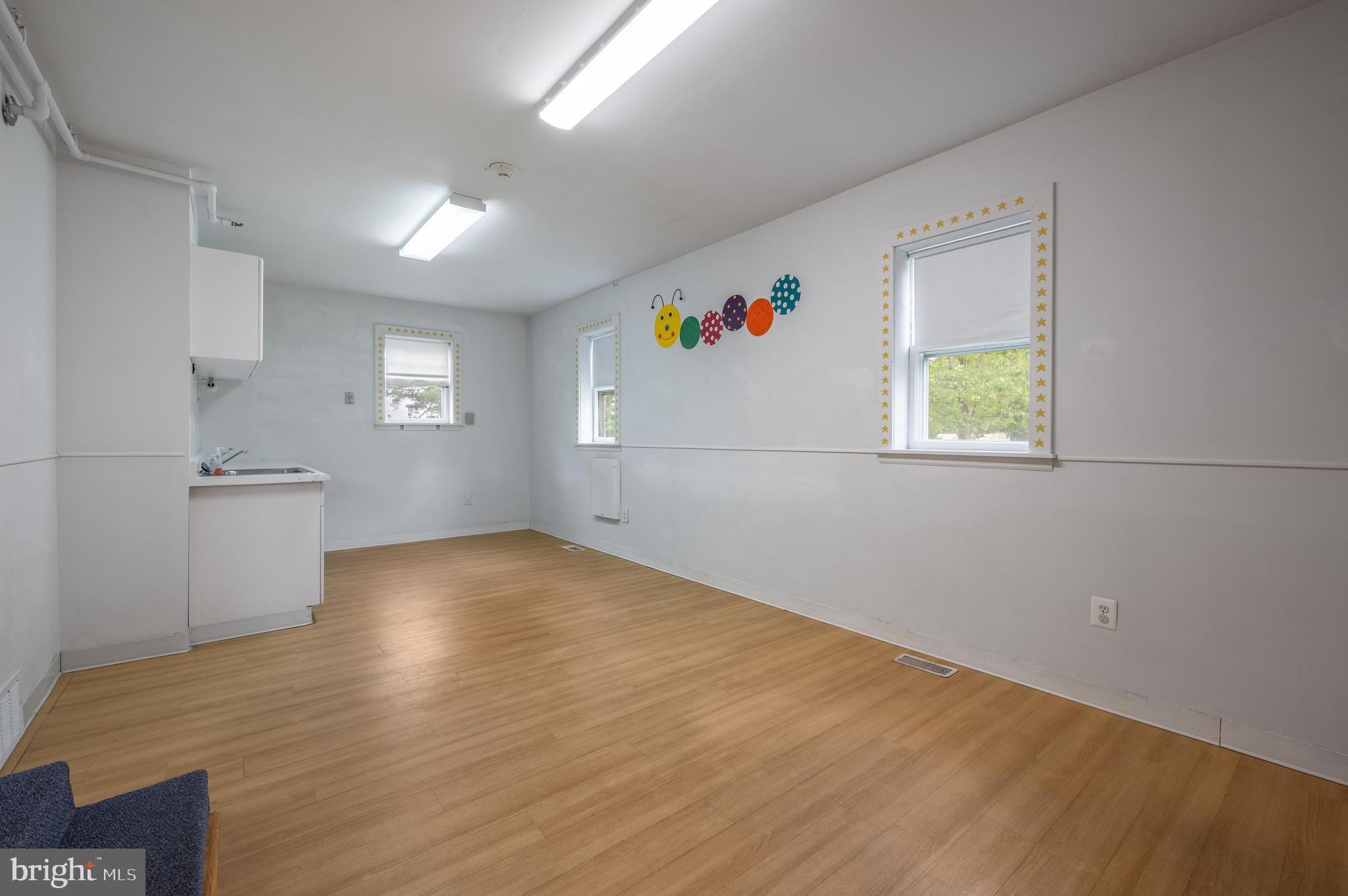 189 Watsontown Road Berlin, NJ 08009 - Photo 19 of 35 a view of empty room with wooden floor and fan